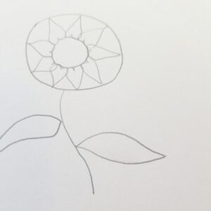 Bible journaling sunflower sketch with added petal outlines around the center circle, drawn in pencil with stem and leaves