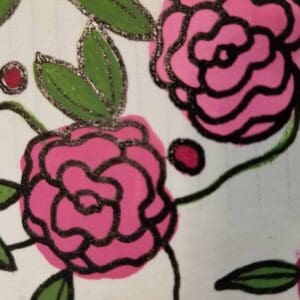 Finished drawing of pink carnations outlined in bold black with green leaves and decorative dots, showcasing a vibrant and stylized flower design for Bible journaling