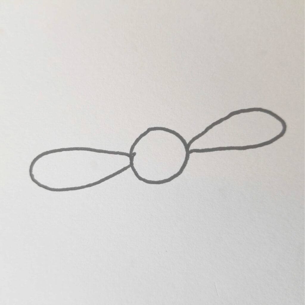 Initial step of drawing a daisy for Bible journaling, featuring a central circle with two opposing oval petals sketched in pencil”