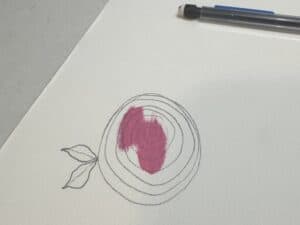 Partially colored spiral rose drawing with pencil outlines and two leaves on watercolor paper, shown next to a black pen — step-by-step flower illustration for Bible journaling.