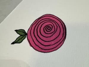 Completed spiral rose drawing with bold black outlines, vibrant pink petals, and green leaves on textured paper — an easy flower design for Bible journaling